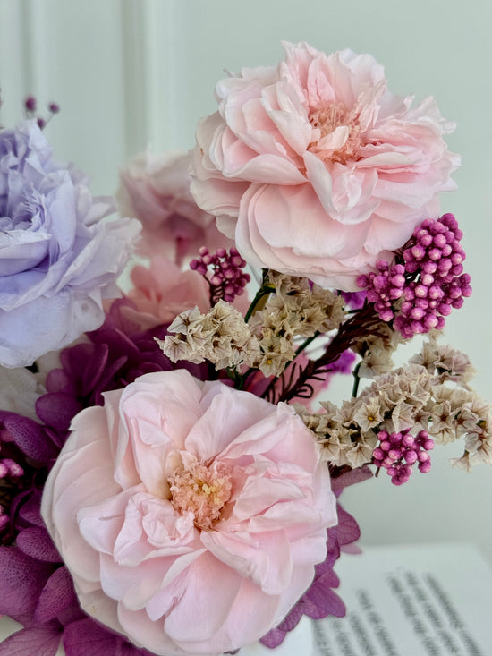 Soft pastel preserved flower arrangement with eternal roses blush lavender ivory
