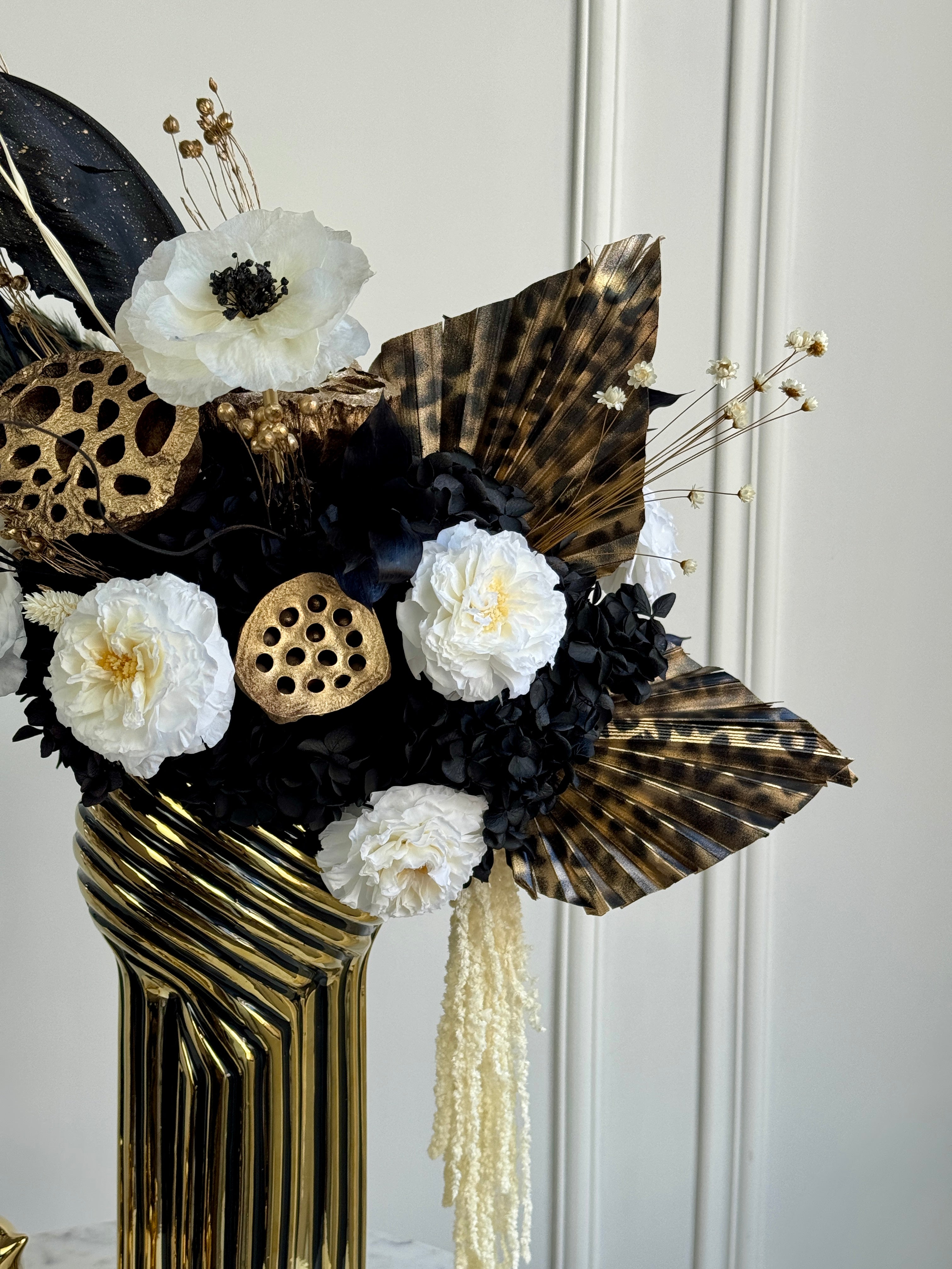 Modern interior preserved floral art with bold contrast organic textures and dark tones