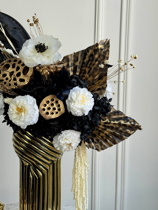 Modern interior preserved floral art with bold contrast organic textures and dark tones