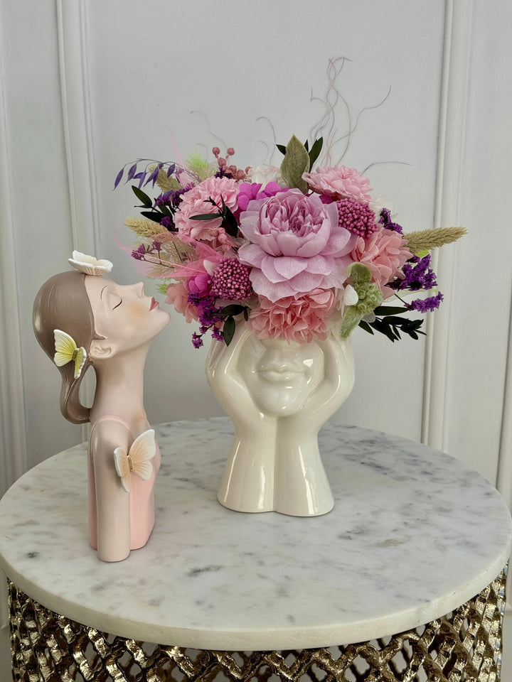 Mademoiselle Soft Pink preserved flowers arrangement in a Los Angeles ceramic face vase.