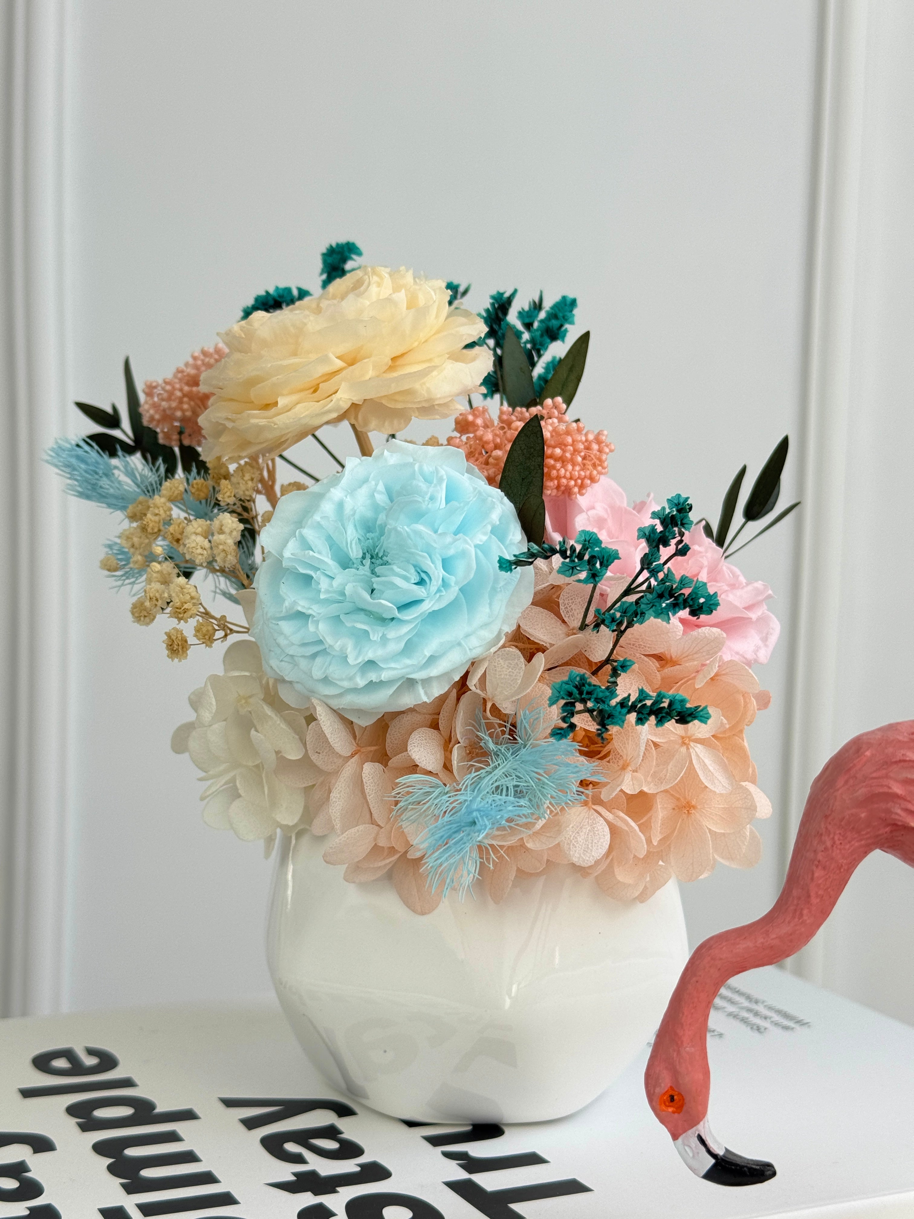 Pastel preserved peony blooms in blush, blue, ivory, peach