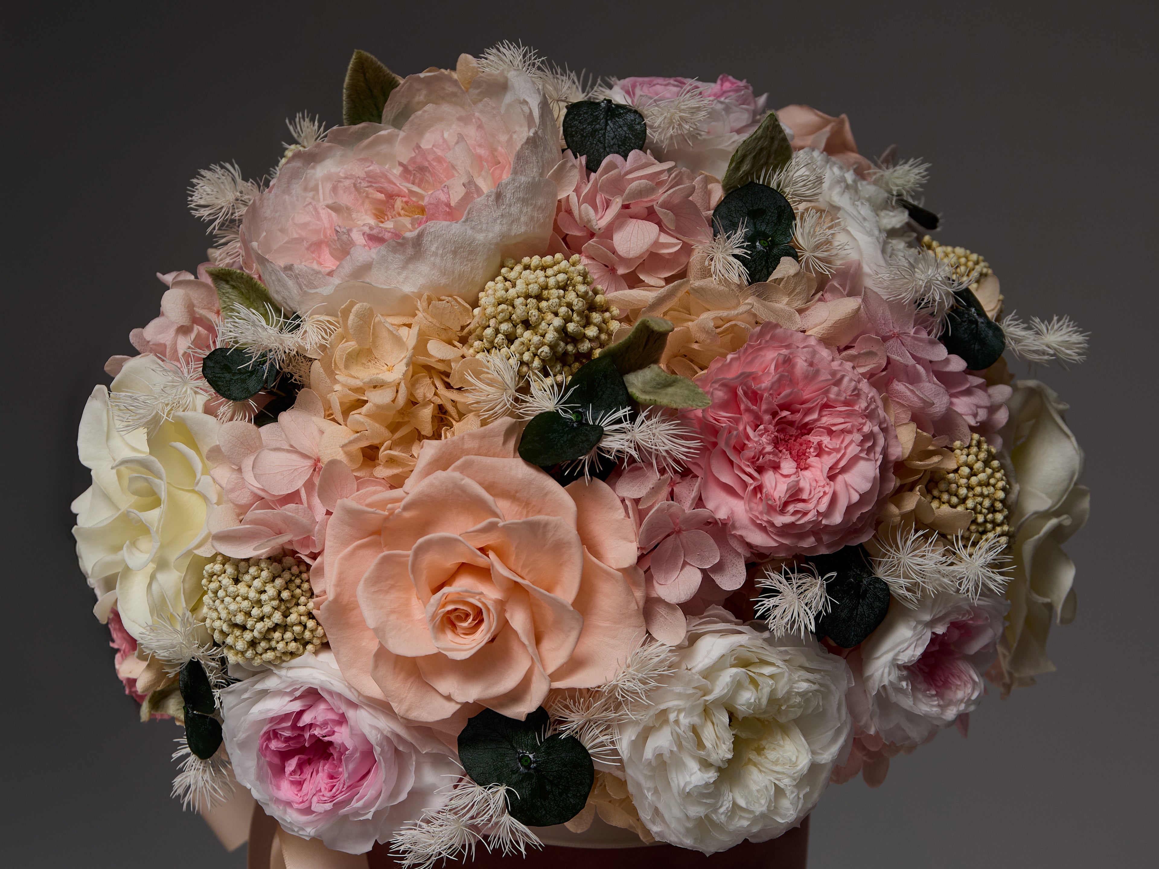Real roses and floral art — no water, no sunlight, just timeless beauty