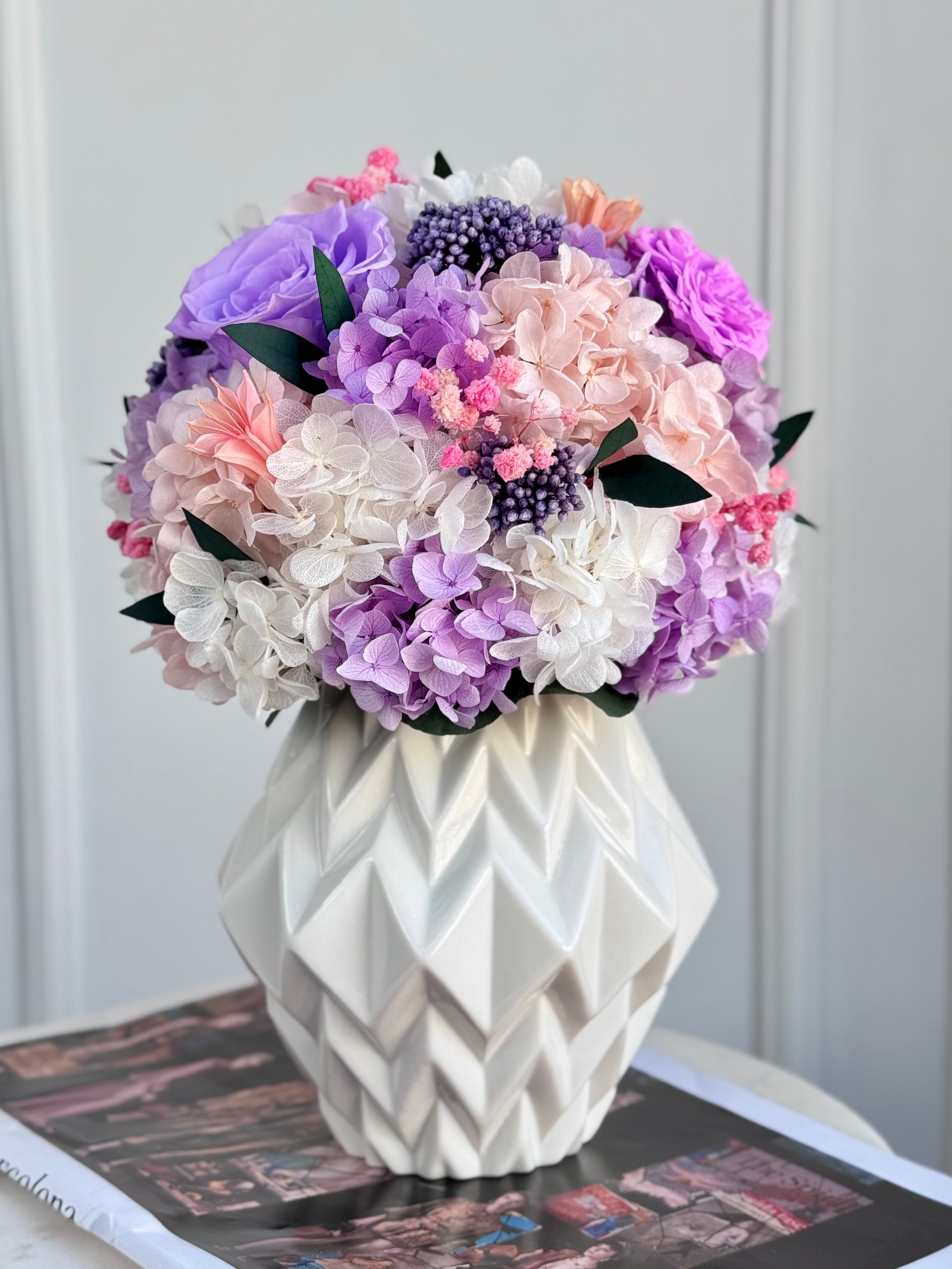 “Lilac Whisper bouquet styled in a minimalist glass vase on modern table”
