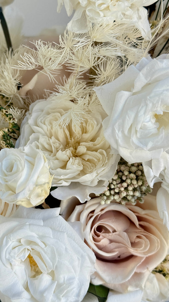 Sculptural preserved flower arrangement with eternal roses