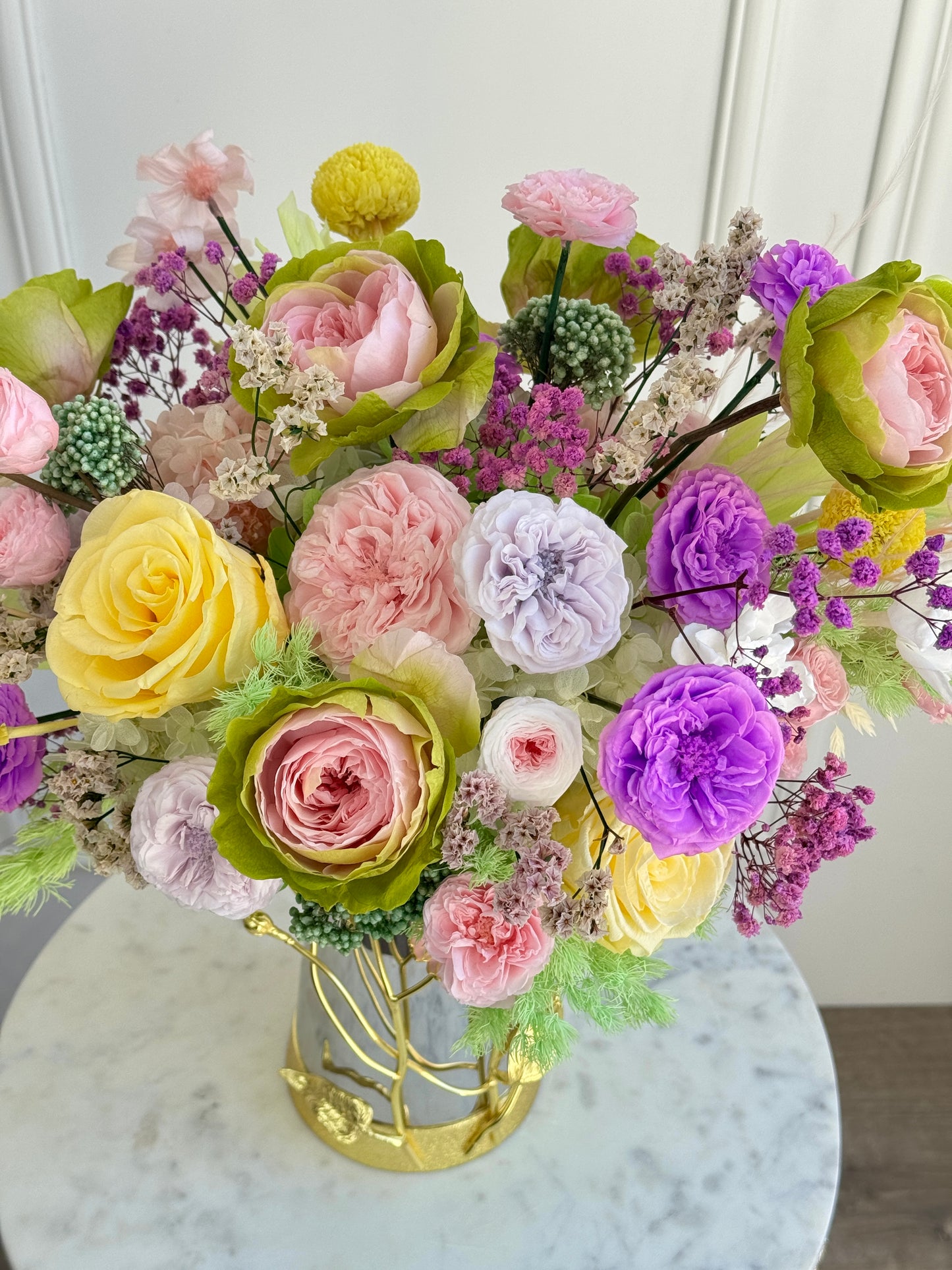 Colorful preserved flower arrangement with eternal roses