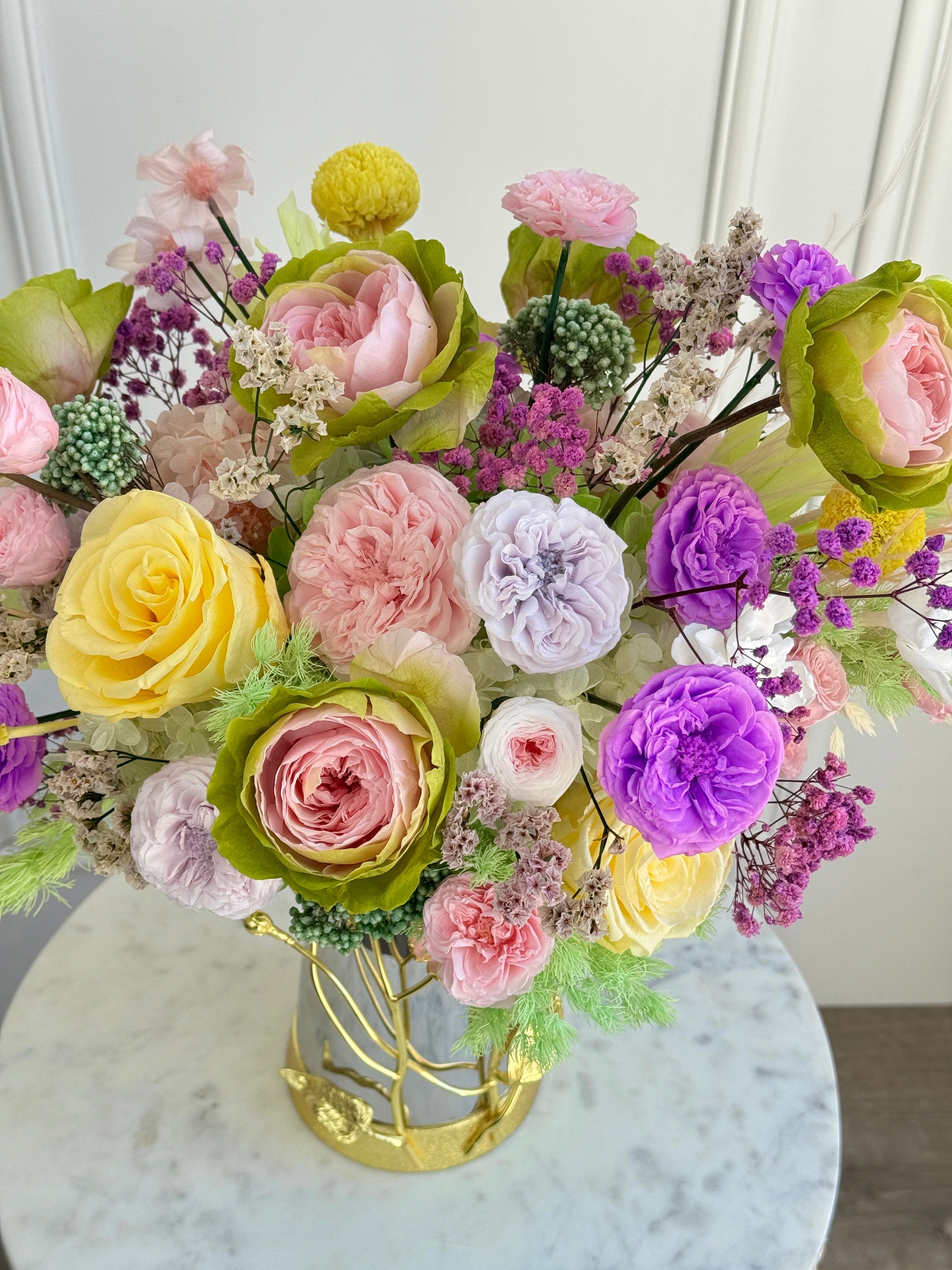 Colorful preserved flower arrangement with eternal roses