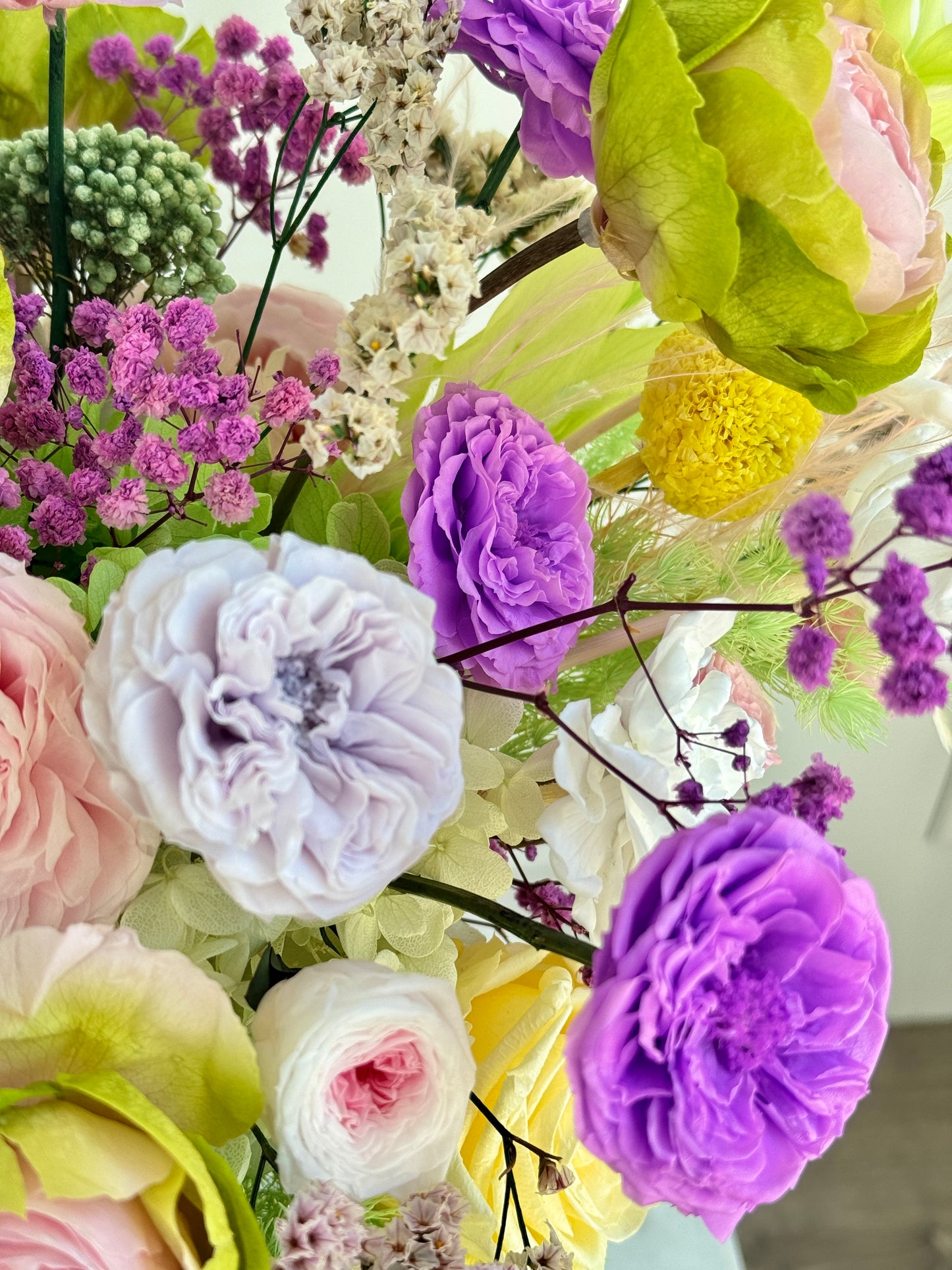 Side view of Vivid Bloom Burst preserved arrangement