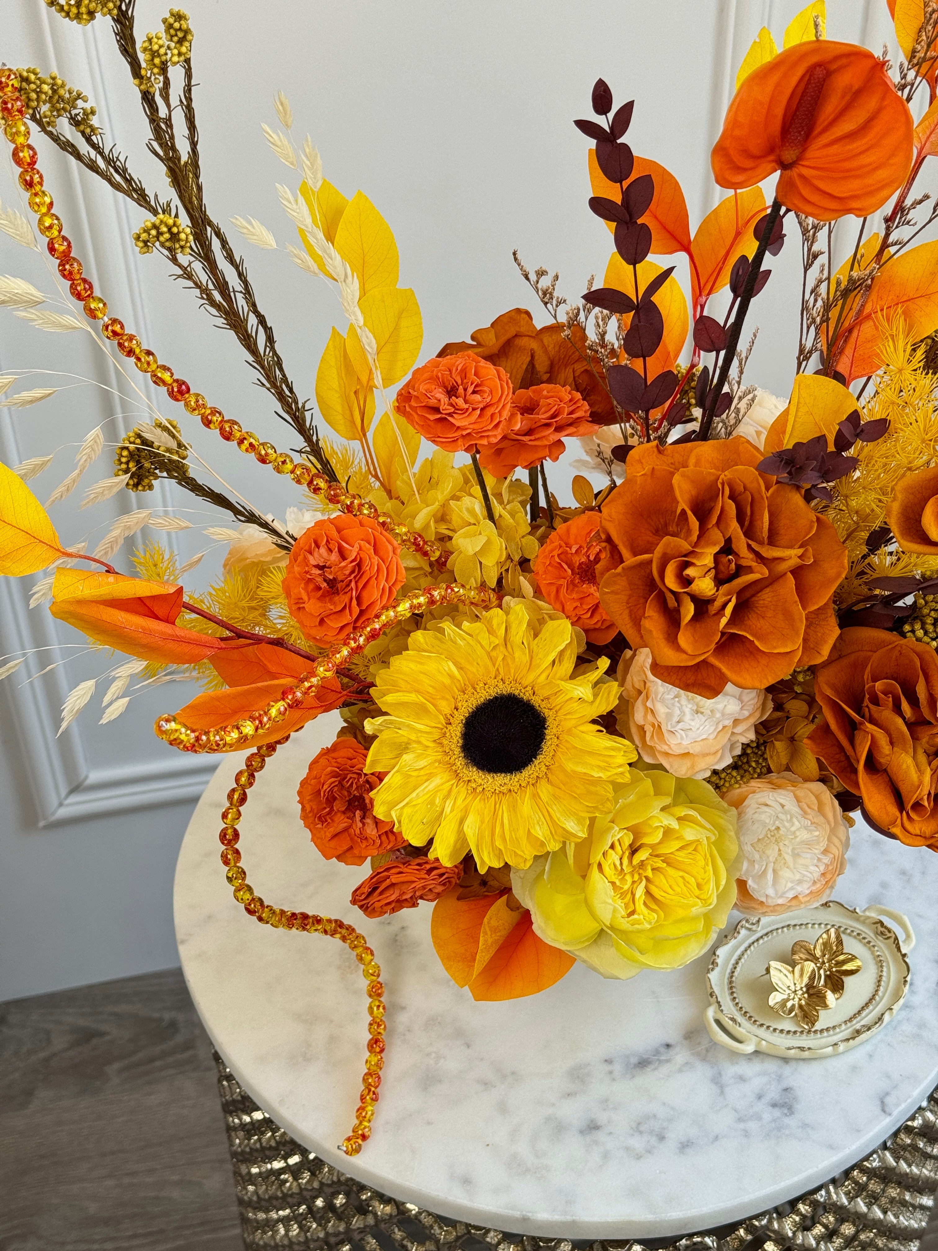 Amber-toned preserved flower décor with beads