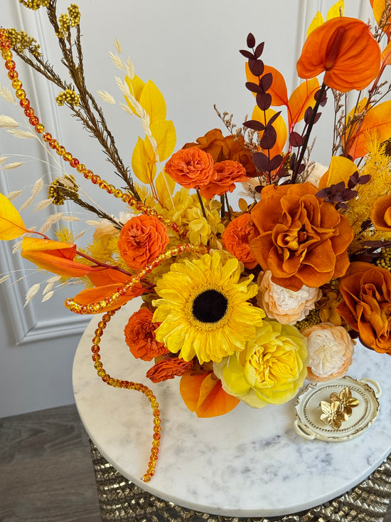 Amber-toned preserved flower décor with beads