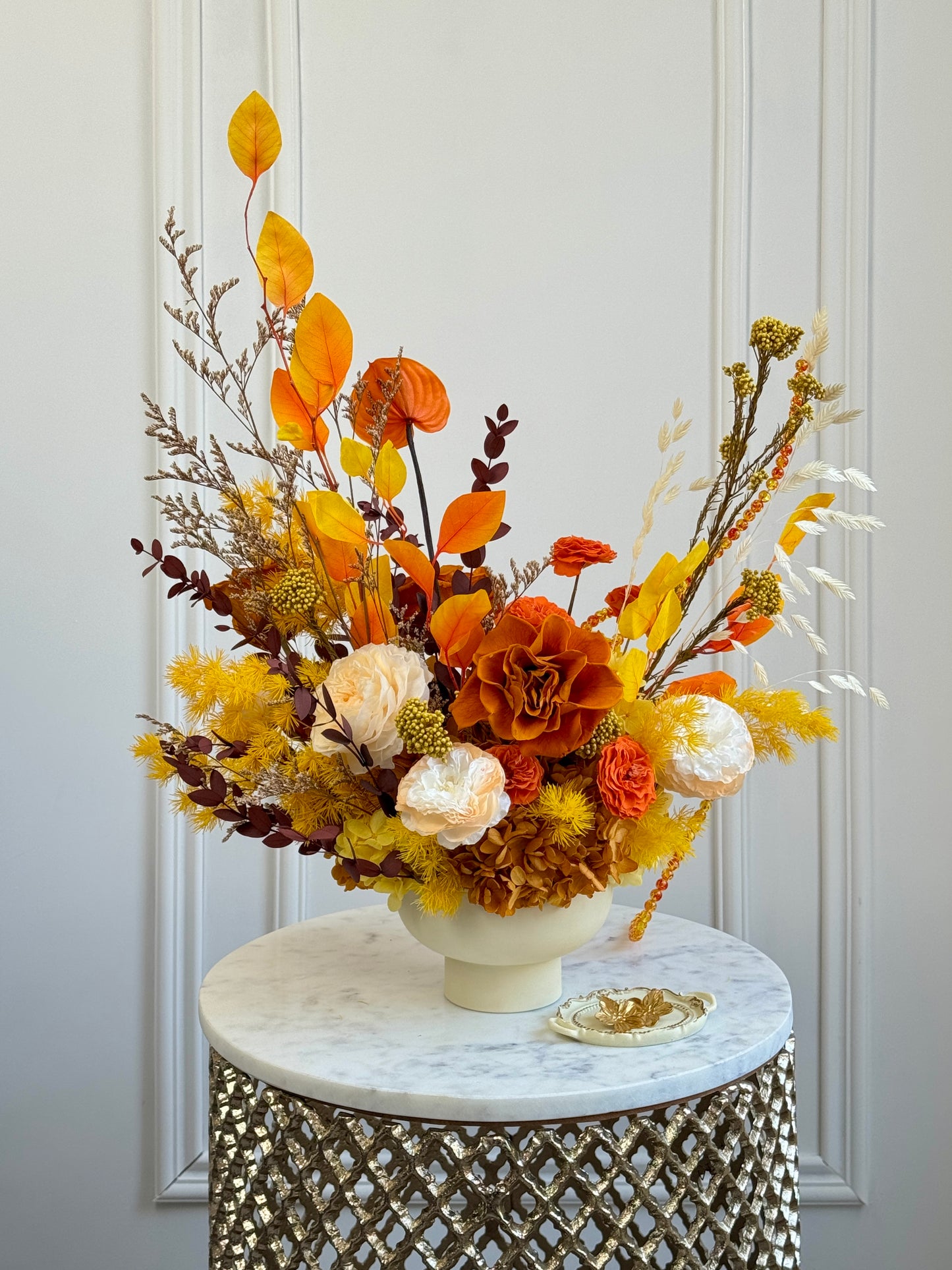 Handcrafted preserved flower arrangement in warm tones