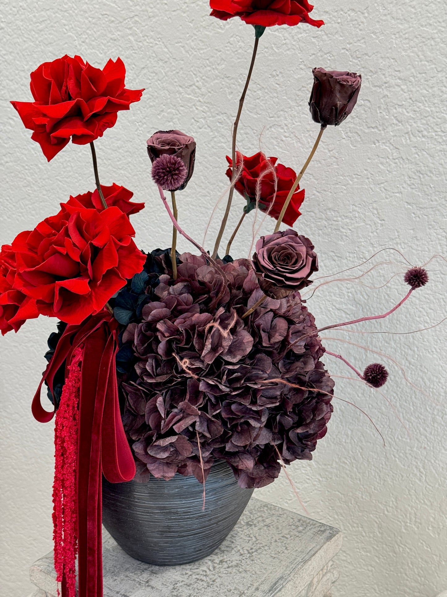 Close-up of Two Wild Roses preserved flowers in vase